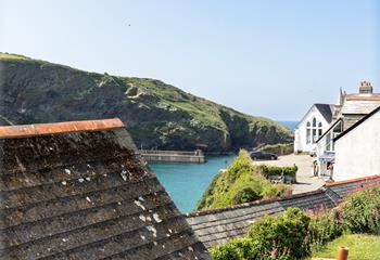 Enjoy the views over the rooftop to the idyllic harbour from the top bedroom.