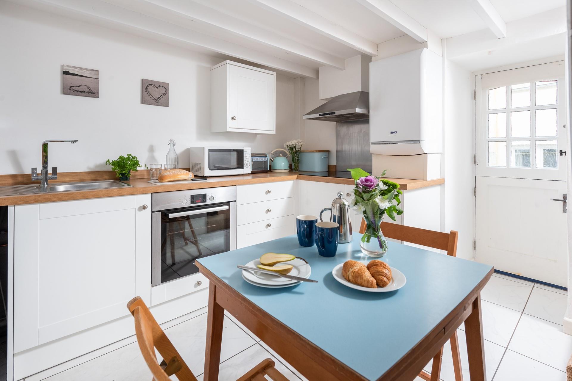The kitchen benefits from a stable door so you can let in the fresh air whilst cooking or enjoying meals.