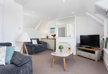Pour yourself a glass of wine to sip in the cosy sitting room after a day in St Ives.
