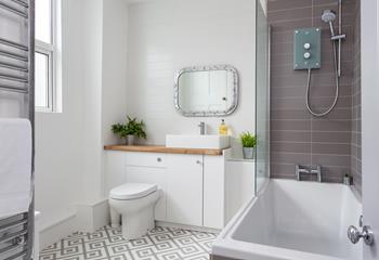 Beautifully finished, enjoy a quick shower or long soak in the bathroom.