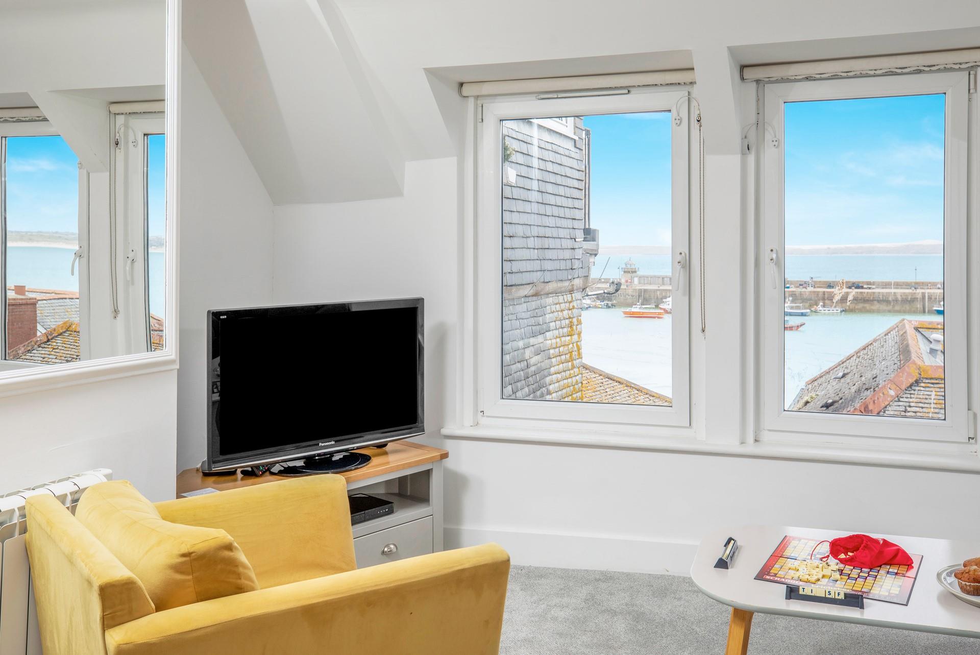 Take in the ever-changing sea view vista from the comfortable sitting room.