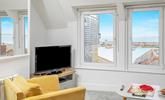 Take in the ever-changing sea view vista from the comfortable sitting room. - Thumbnail Image