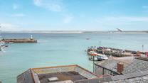 Watch the boats bobbing in iconic St Ives Harbour.