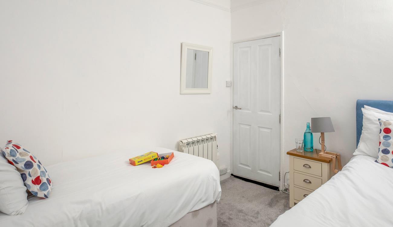 Twin beds allow for flexible sleeping arrangements for families or groups of friends.