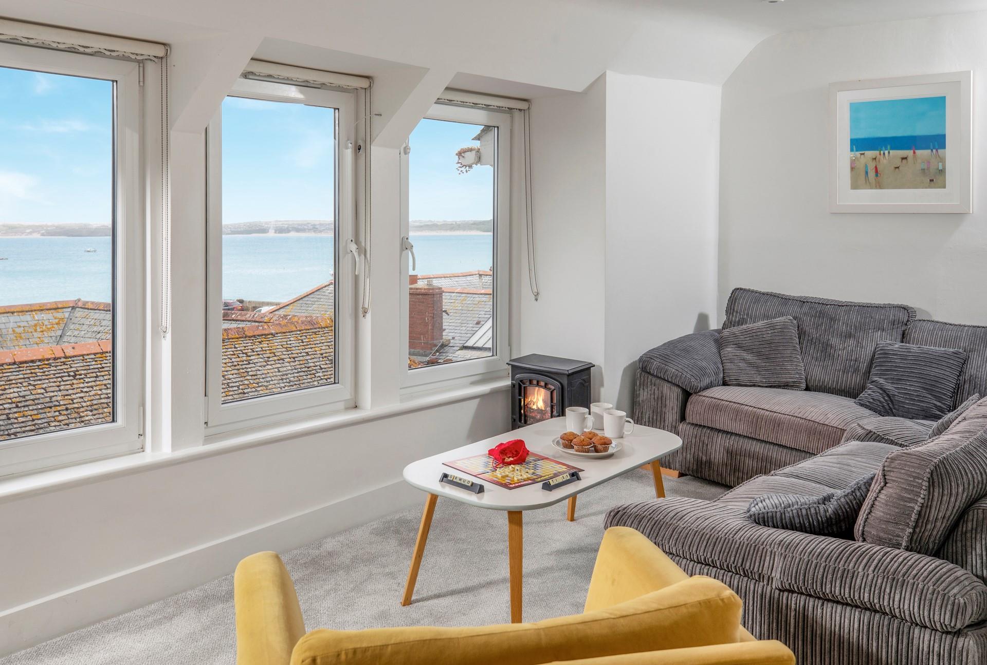 After a busy day exploring St Ives relax on the soft corner sofa with a glass of your favourite tipple and admire the view.