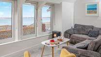 After a busy day exploring St Ives relax on the soft corner sofa with a glass of your favourite tipple and admire the view.