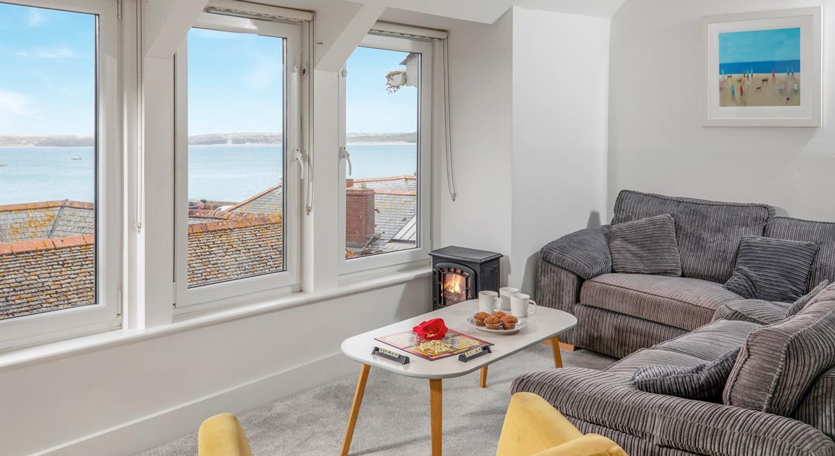 After a busy day exploring St Ives relax on the soft corner sofa with a glass of your favourite tipple and admire the view.