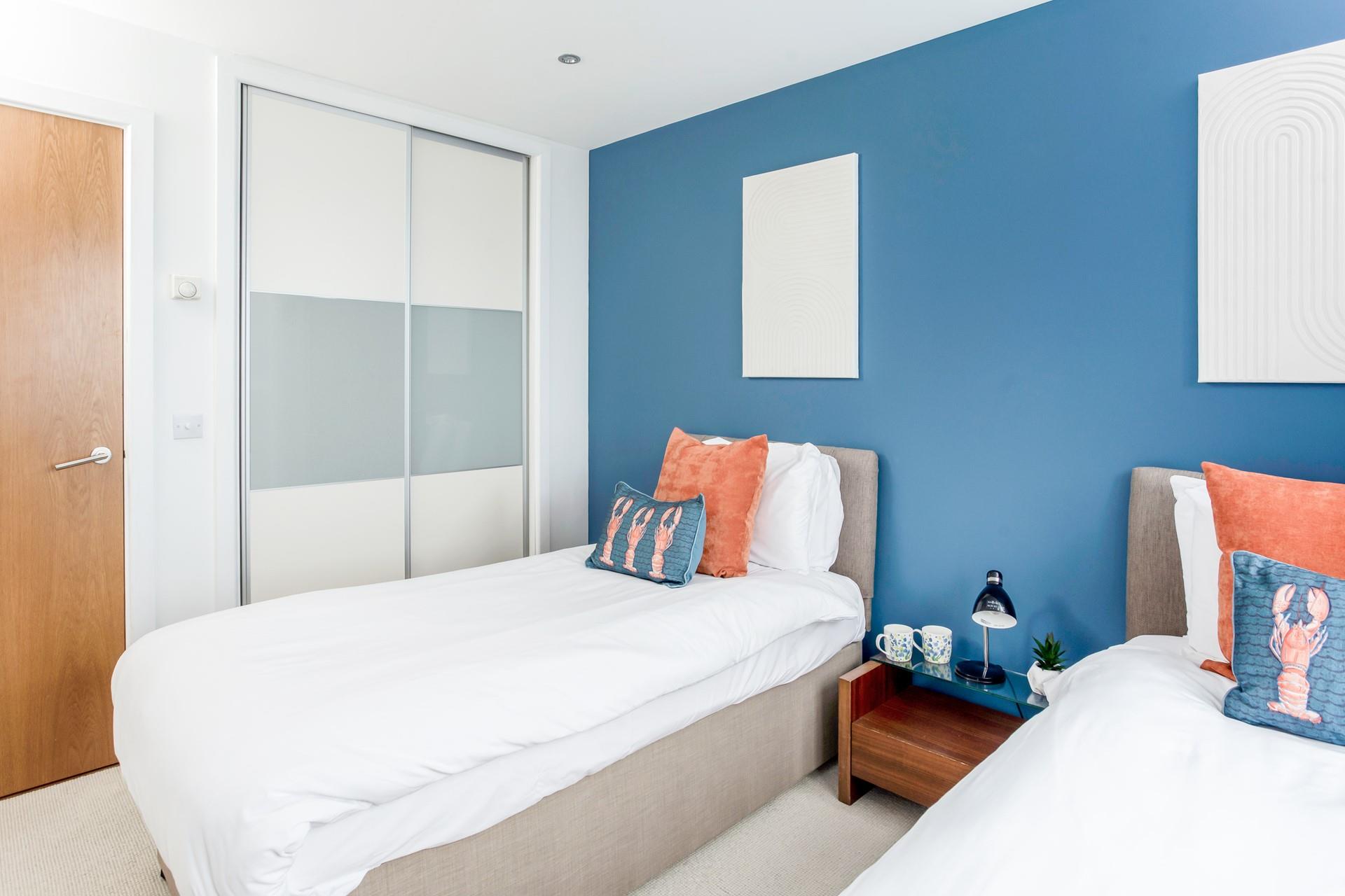 Muted, pastel tones create a relaxing atmosphere, perfect for getting a restful night's sleep.