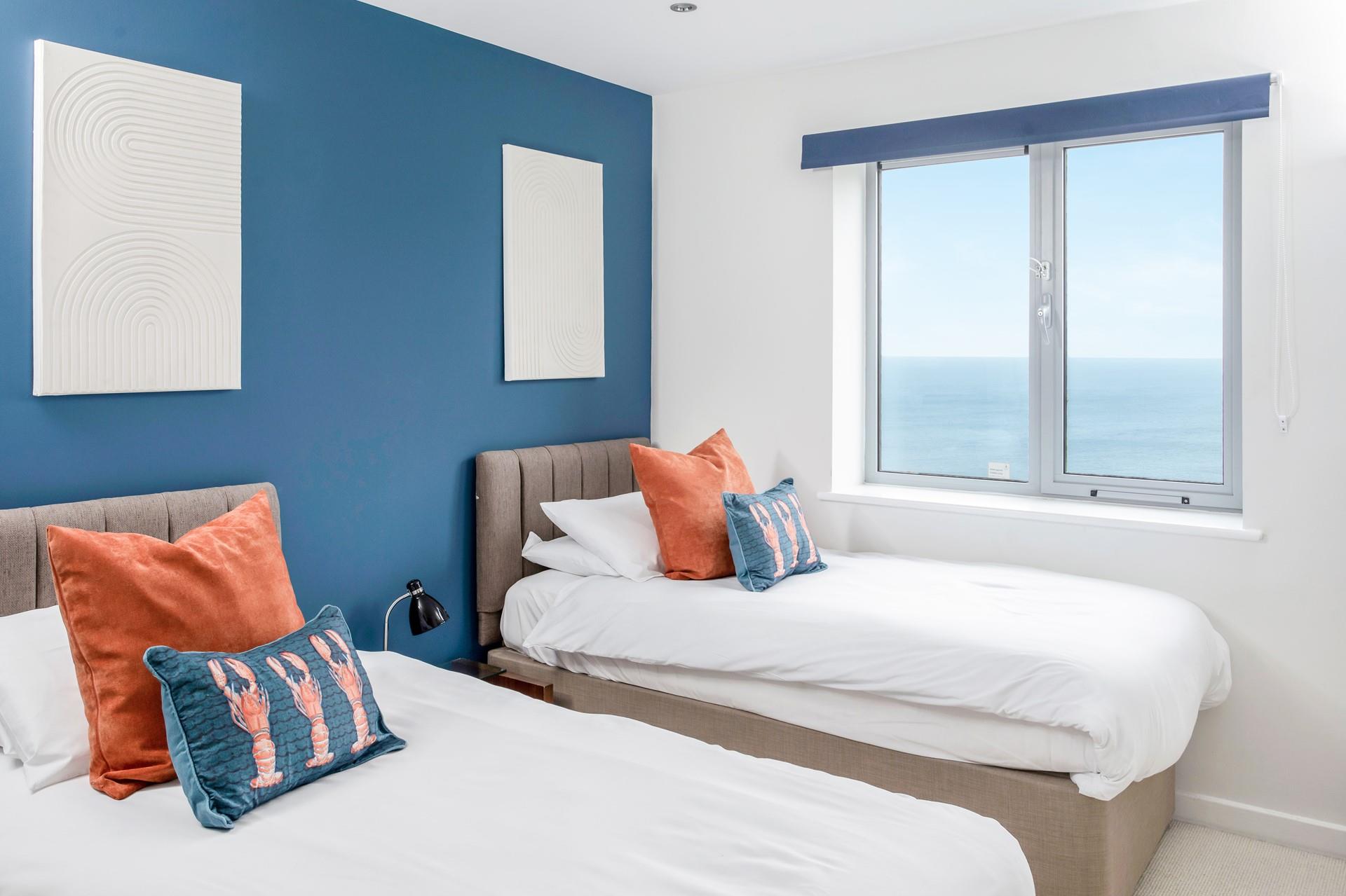 Bedroom 1 has more delightful views and with zip and link beds, this is the ideal choice for couples and/or those with children.