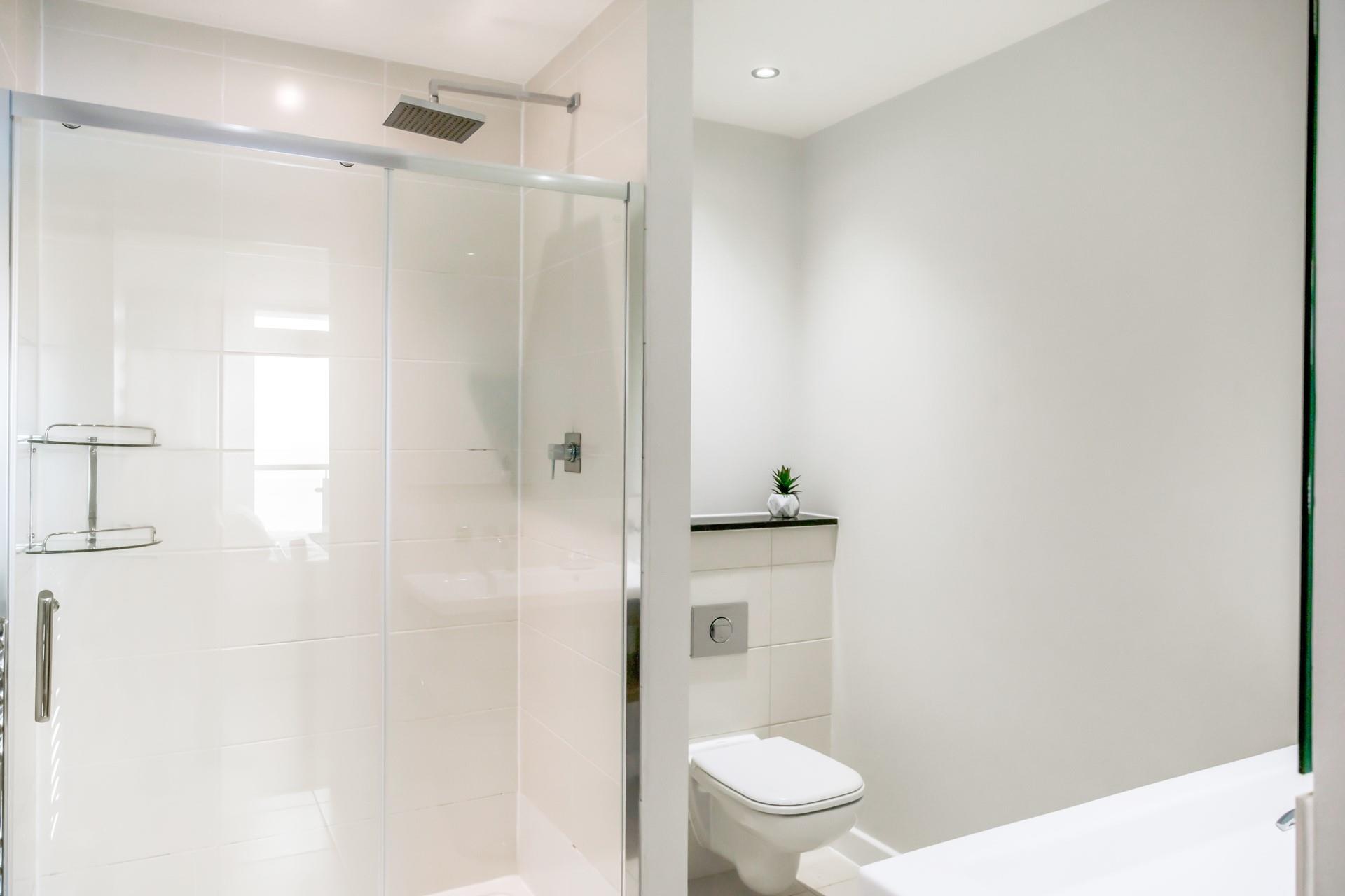 The en suite shower room in bedroom 2 has a glorious walk-in shower and double sink.