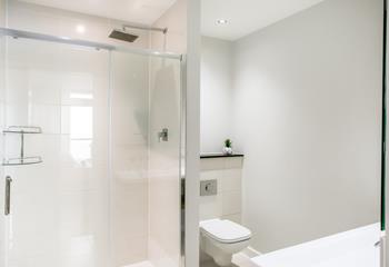 The en suite shower room in bedroom 2 has a glorious walk-in shower and double sink.