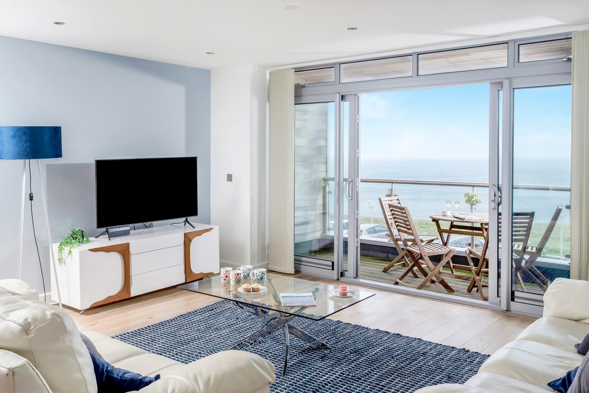 The open plan living area boasts sea views and doors to the balcony where you can sit and while away the hours watching the fishing boats.