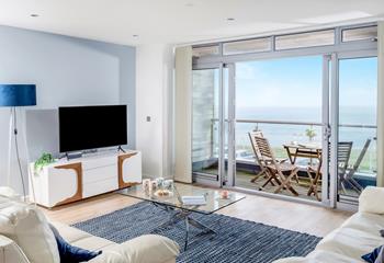 The open plan living area boasts sea views and doors to the balcony where you can sit and while away the hours watching the fishing boats.