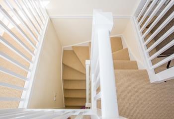 A contemporary stairwell takes you from the ground floor to the second floor.