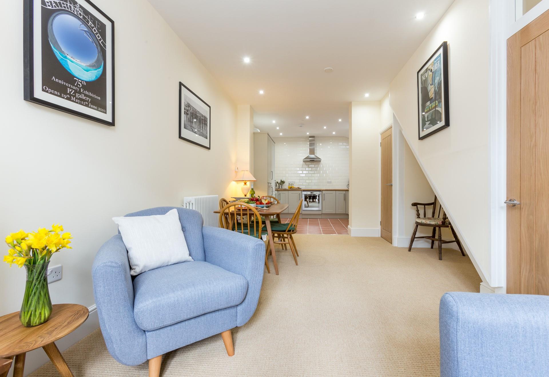 A welcoming open plan living, dining and kitchen area.