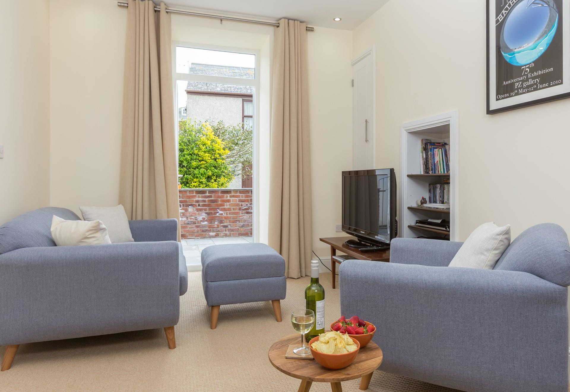 Relax in the sitting area, letting the Cornish sunshine in.