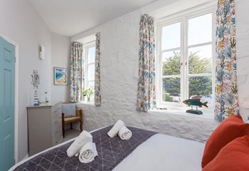 The main bedroom is light and cosy and offers sea views.