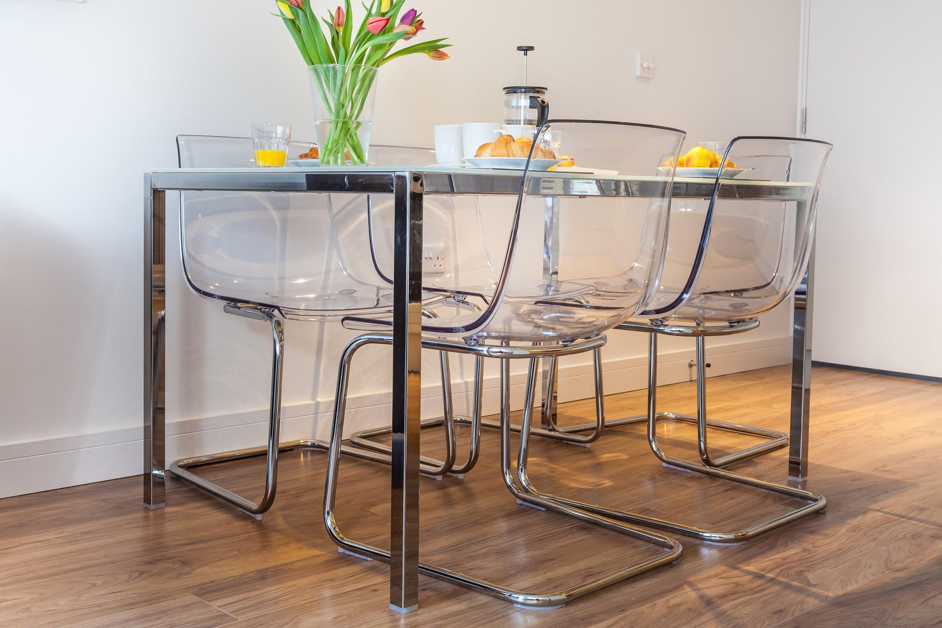 A unique table and chairs add a modern twist to the living area.