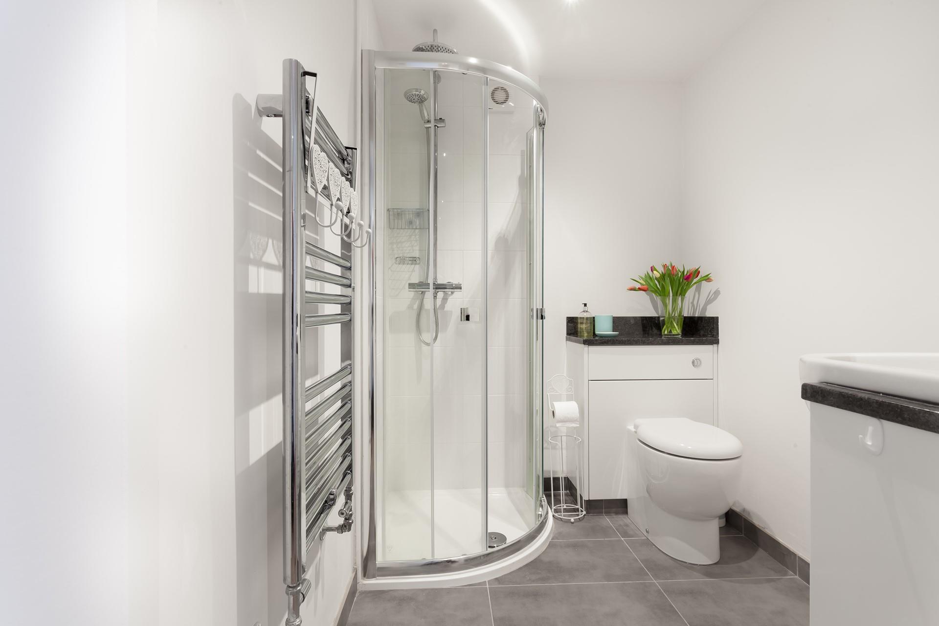 The bathroom has a lovely, sleek design.