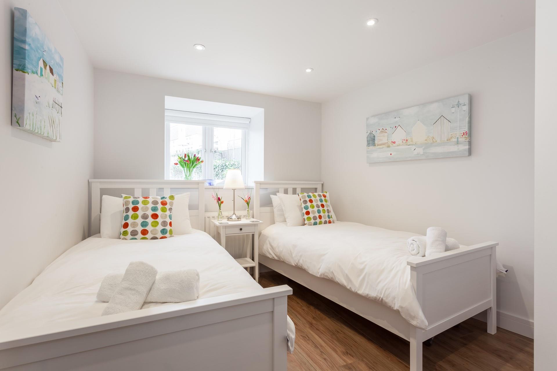 The twin bedroom with its pretty prints and cosy beds is perfect for children.