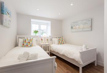 The twin bedroom with its pretty prints and cosy beds is perfect for children.