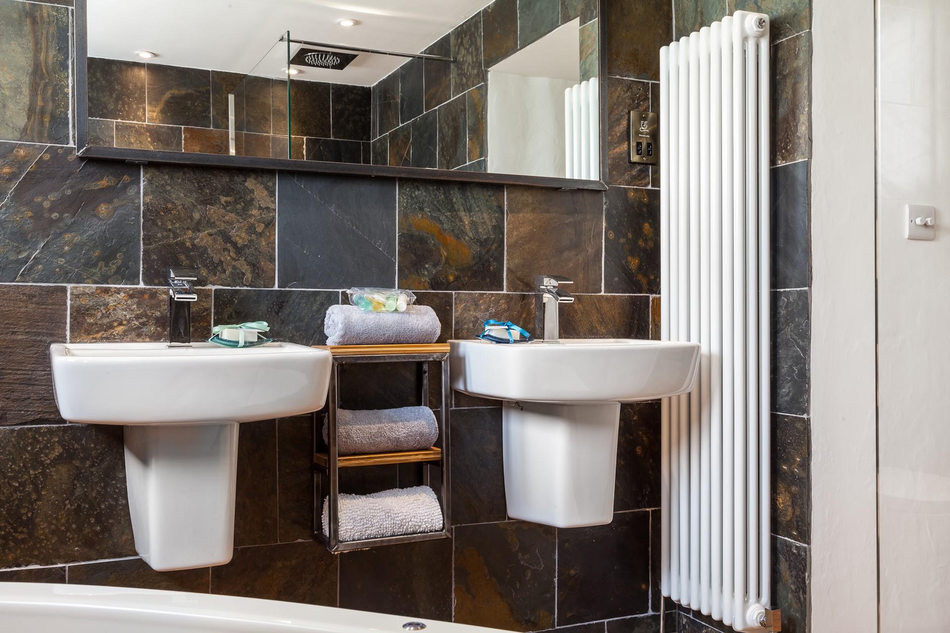 His and hers sinks offer couples the space to get ready together.