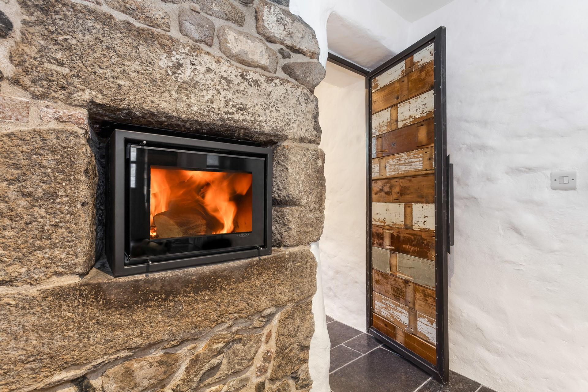 On chilly evenings light up the log burner to warm up.