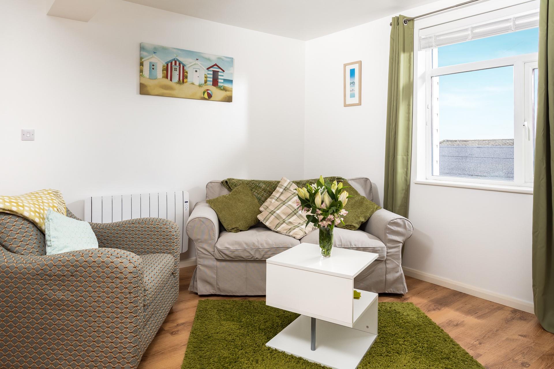 The cosy sitting room provides you with a haven of relaxation in the evenings.