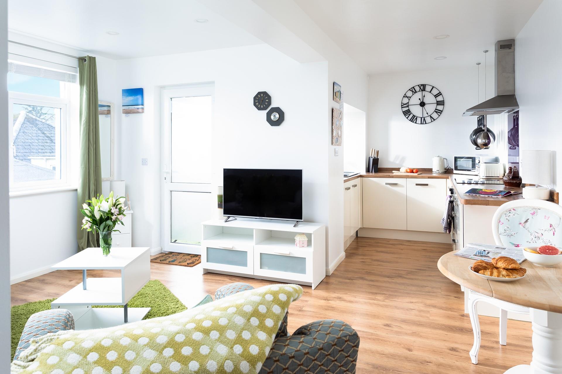 The open plan sitting/dining/kitchen area, is great for catching up on the day's activities.