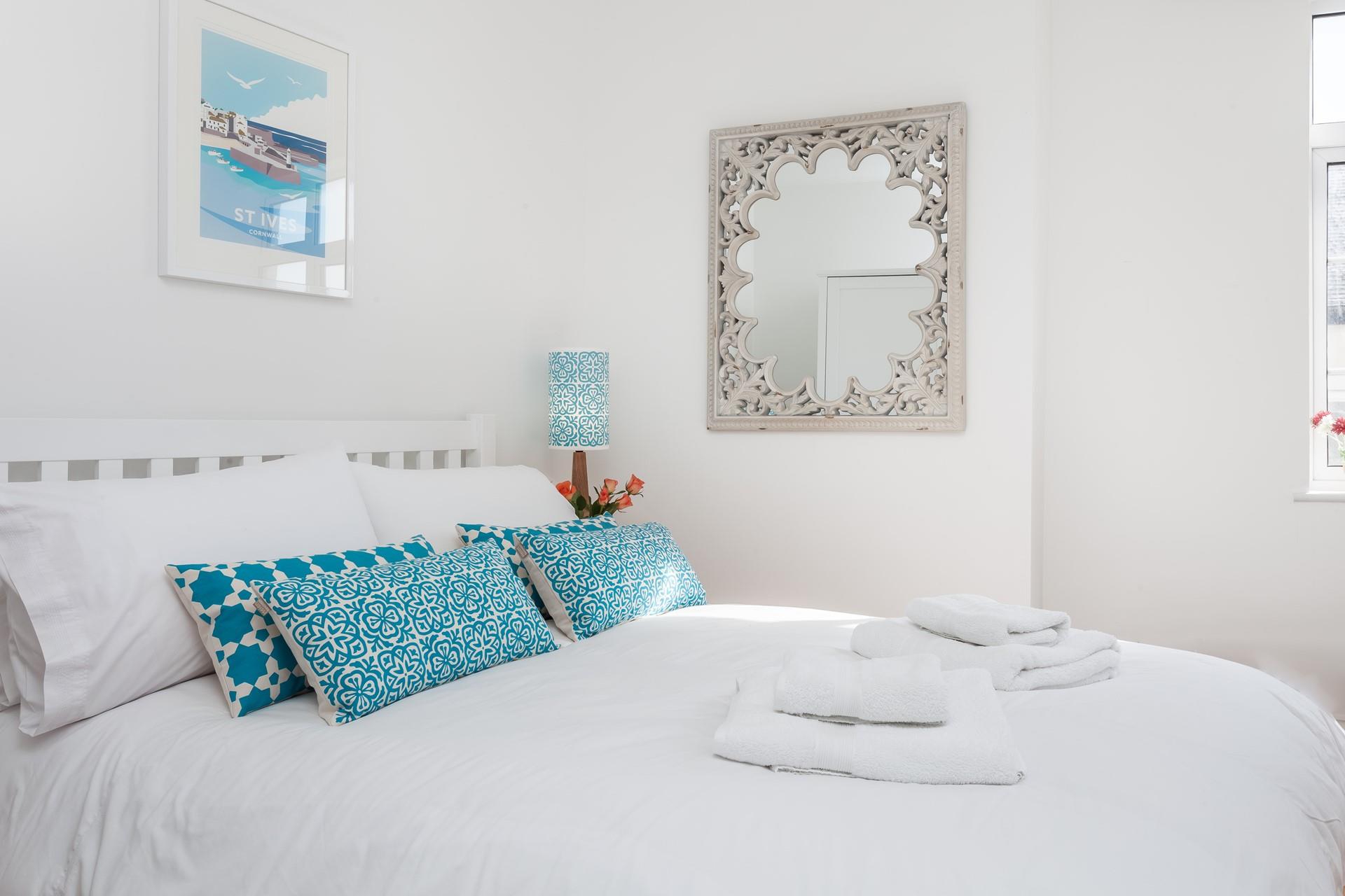 A relaxing night's sleep, crisp white bedding, and beautiful touches await you.