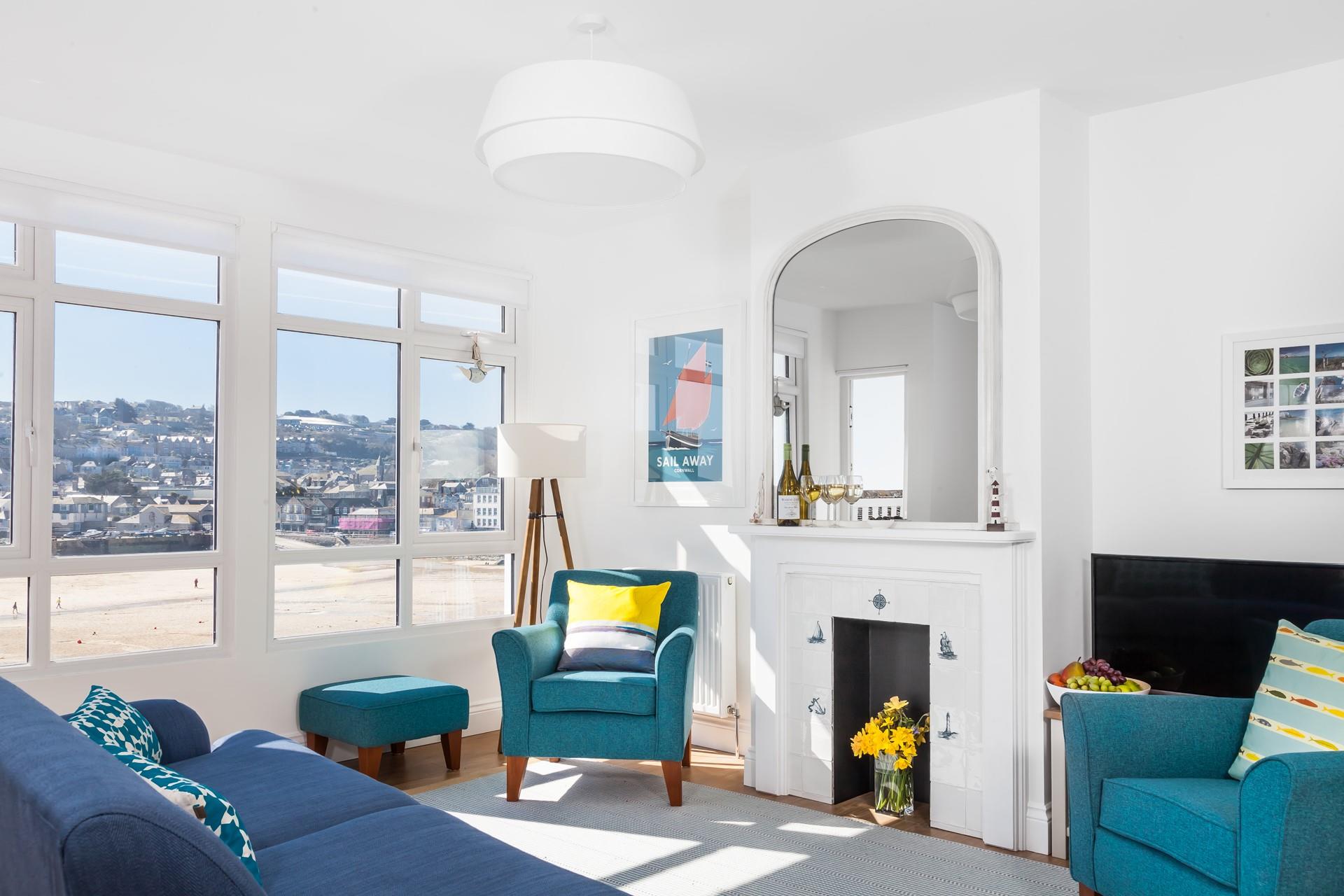 You'll be itching to get outside when you see this view. The living room mixes style with a relaxed coastal charm.