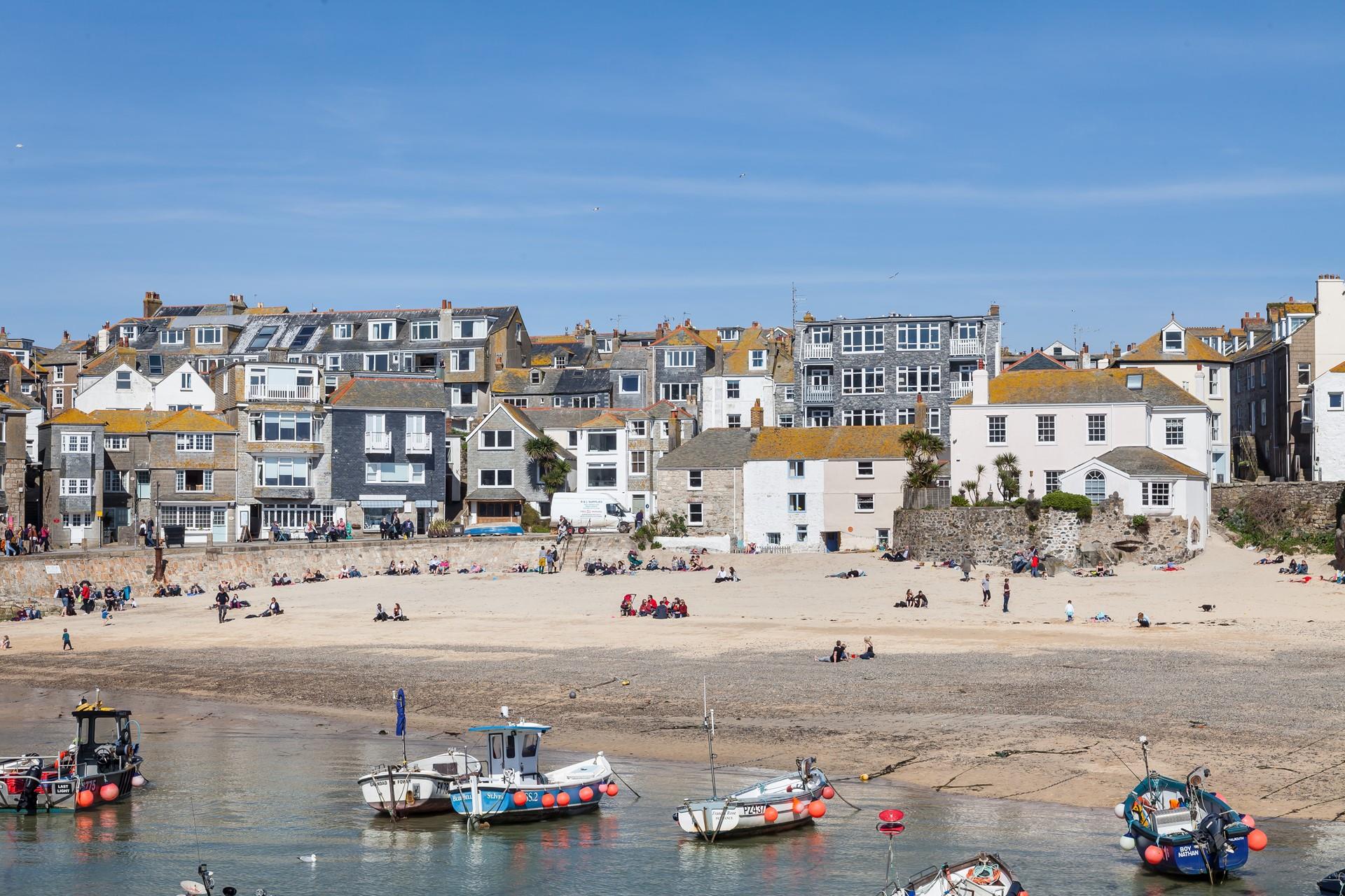Watch the boats bobbing in the harbour from your window.