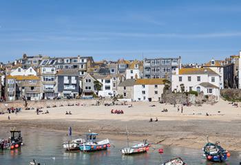 Watch the boats bobbing in the harbour from your window.