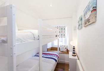Settle the kids into the bunk beds and open a bottle of wine to sip in the cosy sitting room.