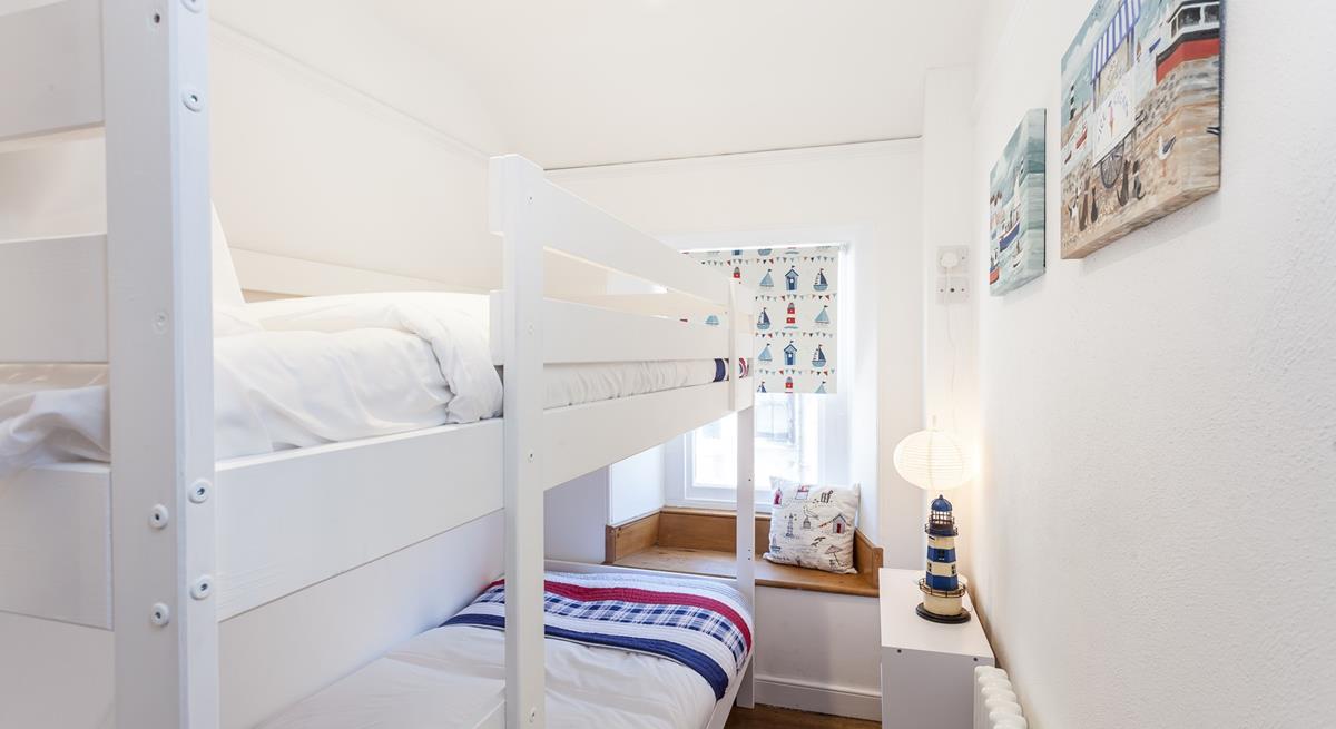 Settle the kids into the bunk beds and open a bottle of wine to sip in the cosy sitting room.