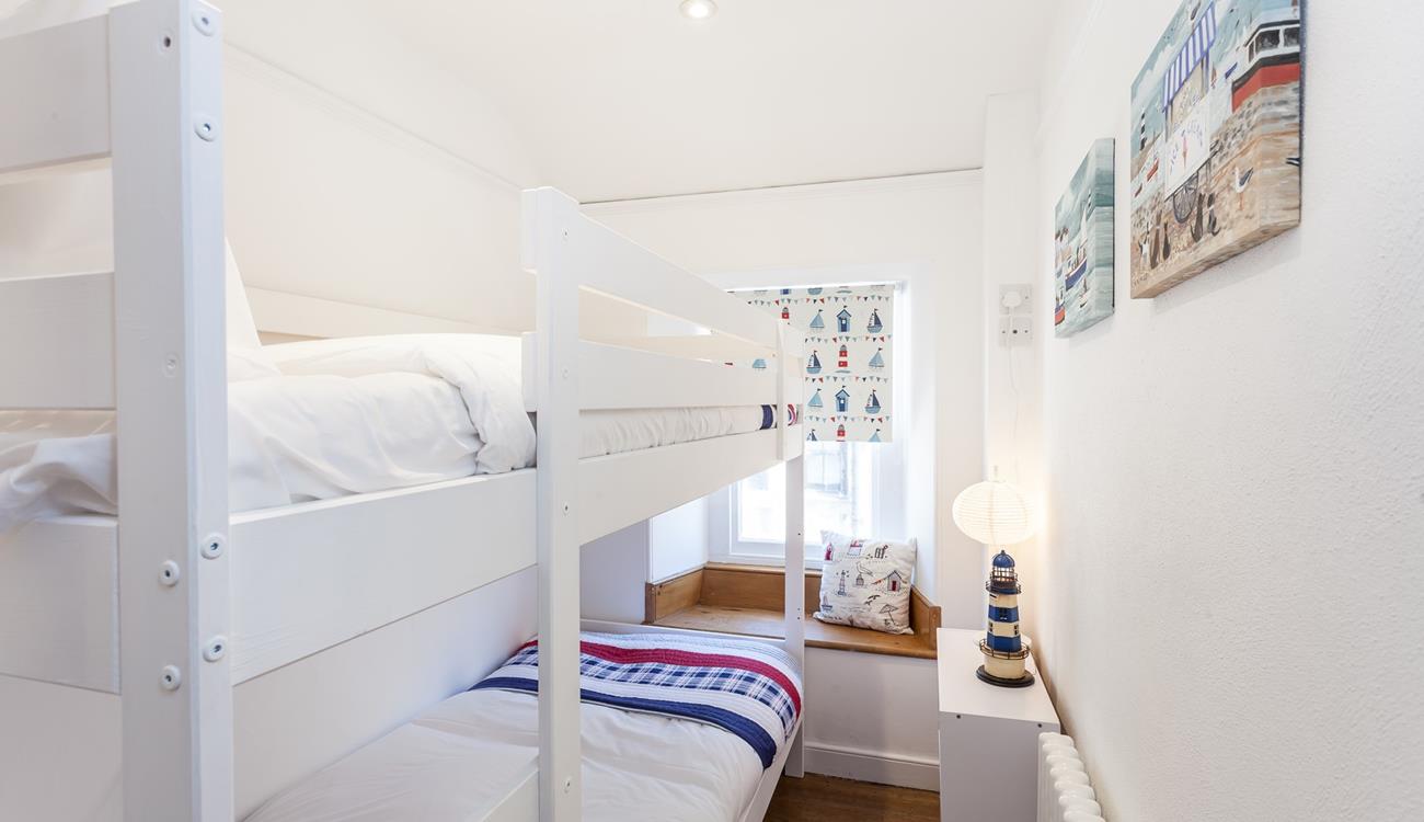 Settle the kids into the bunk beds and open a bottle of wine to sip in the cosy sitting room.