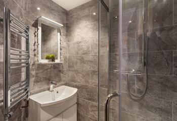 The stylish en suite shower room provides you with a base to get ready in the mornings.