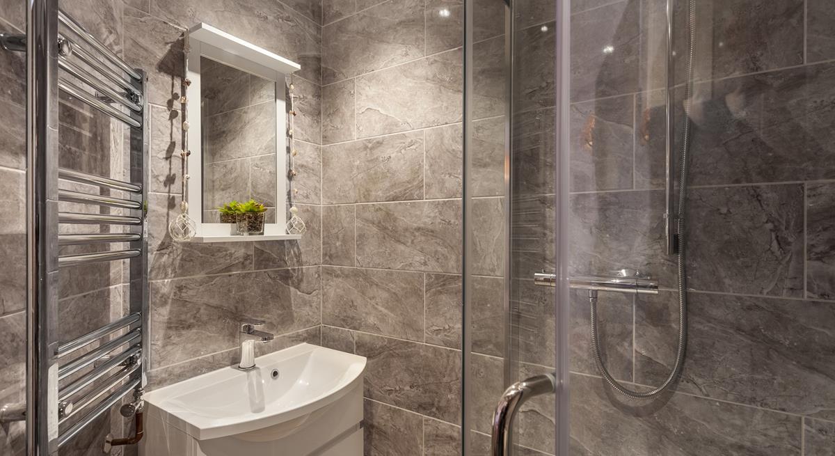 The stylish en suite shower room provides you with a base to get ready in the mornings.