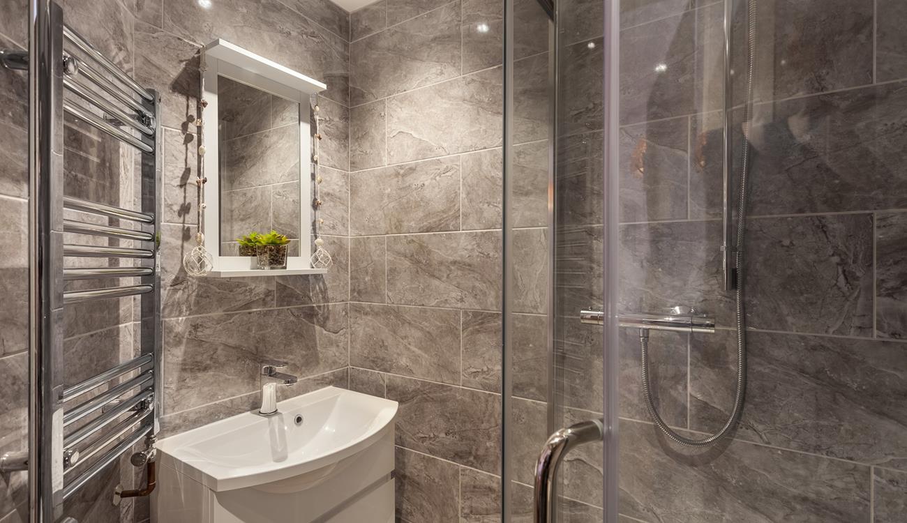 The stylish en suite shower room provides you with a base to get ready in the mornings.