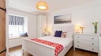 Bedroom 4 is located on the 2nd floor and features blue and red interiors providing you with a cosy base to rest your head.