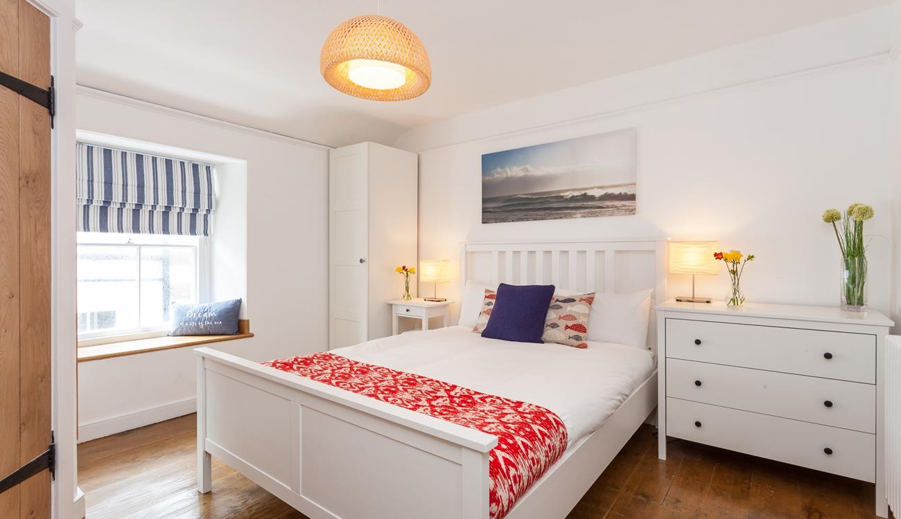 Bedroom 4 is located on the 2nd floor and features blue and red interiors providing you with a cosy base to rest your head.