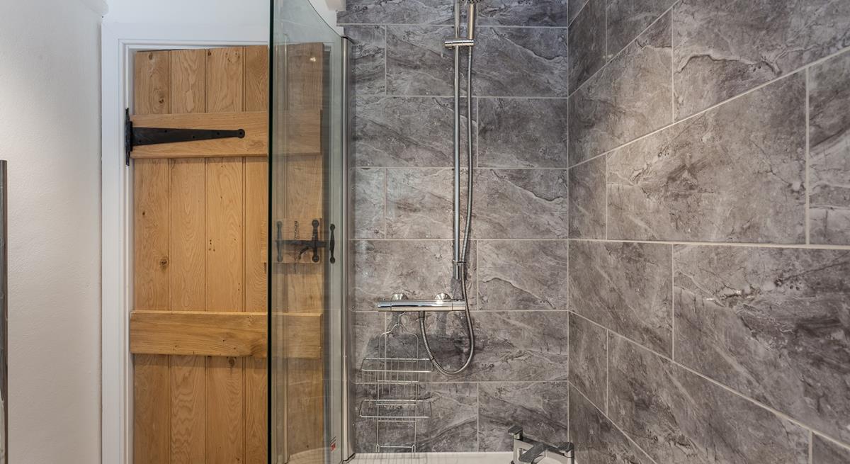 Wash off the sand in the shower after a sunny beach day.