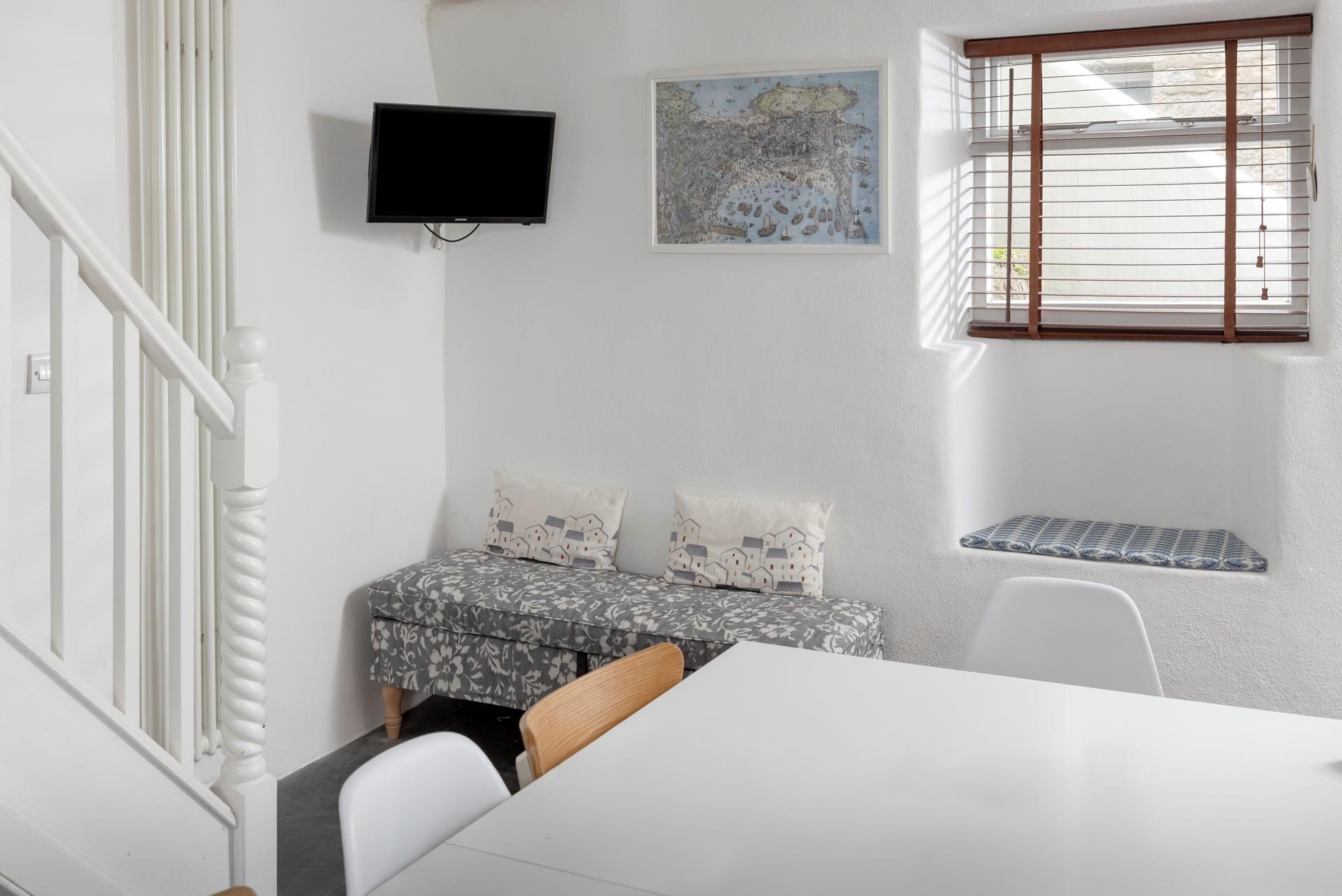 Wander up the stairs to relax in the sitting room.