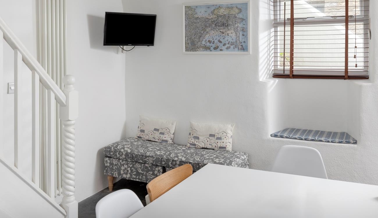 Wander up the stairs to relax in the sitting room.