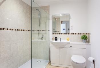 The shower room has a spacious walk-in shower, perfect for an invigorating, luxury start to your day.