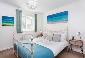 Bedroom 1 is decorated in a distinctly seaside style reminding you just how close to the sea you are!