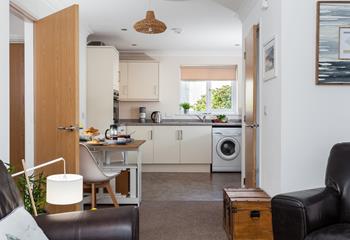 The open plan living and kitchen area creates a homely feel; perfect for relaxing together.