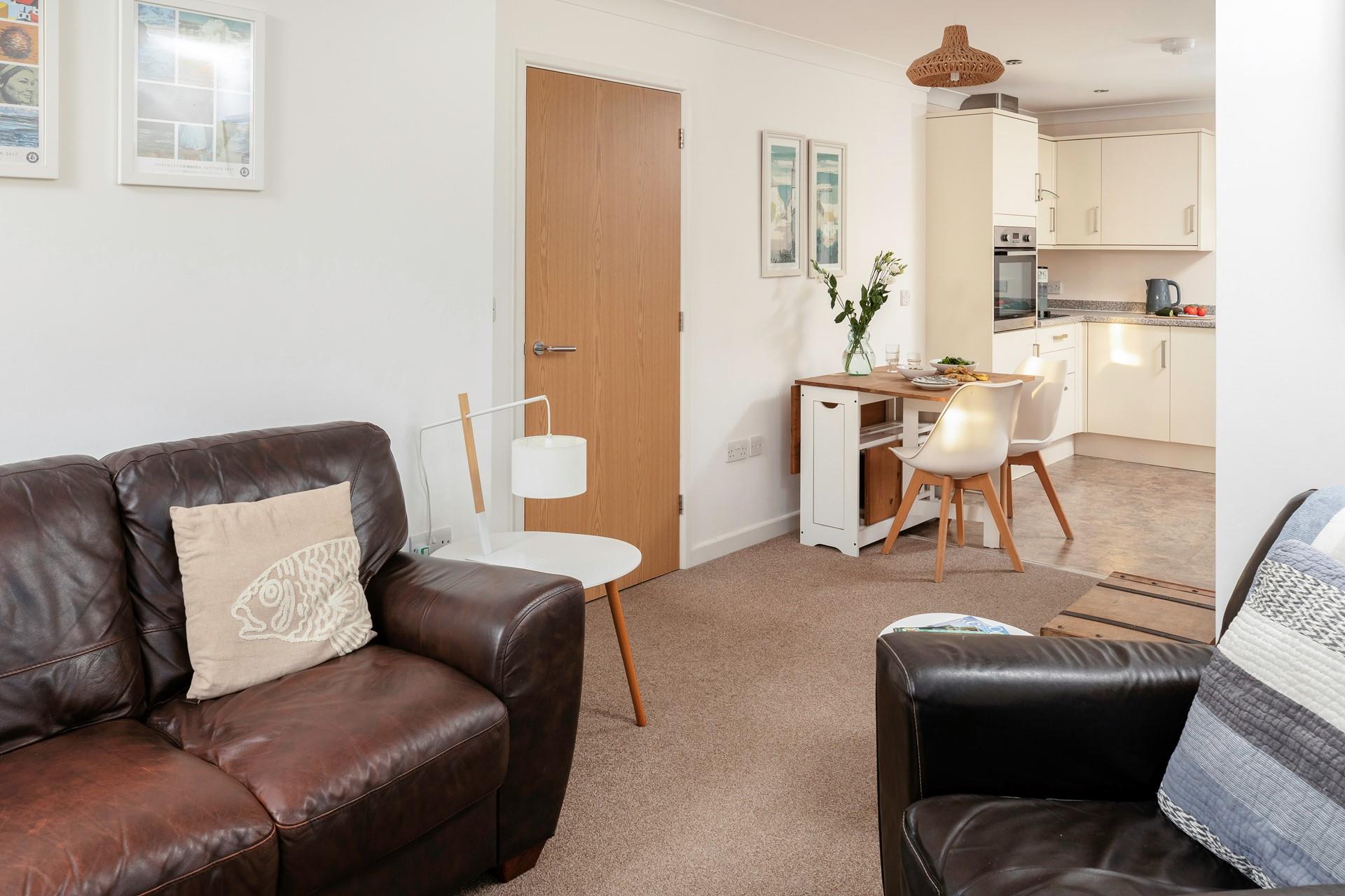 The open plan living and kitchen area creates a homely feel; perfect for relaxing together.