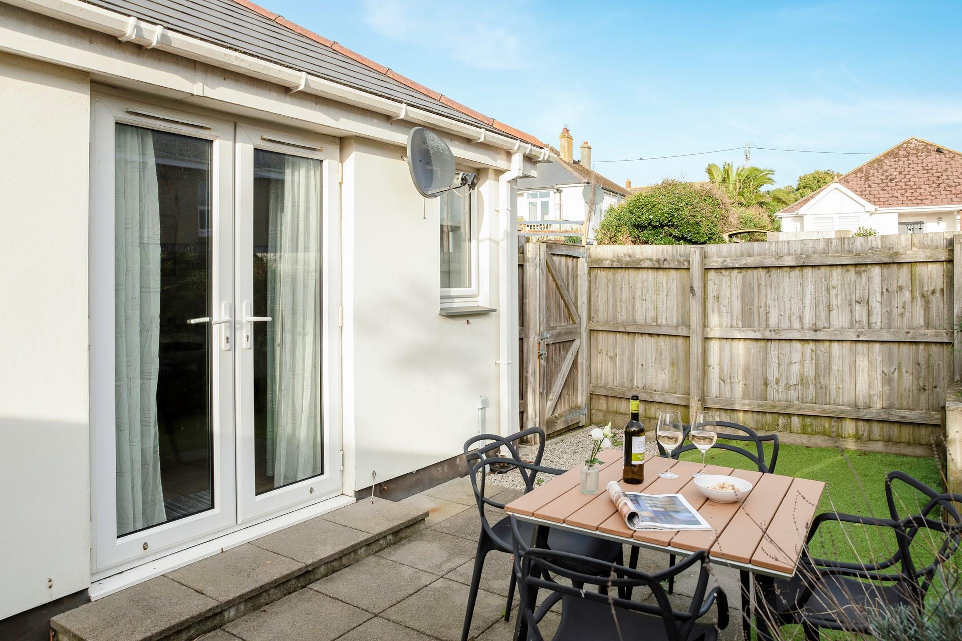 The courtyard garden is the perfect spot for relaxing after a busy day on the beach.