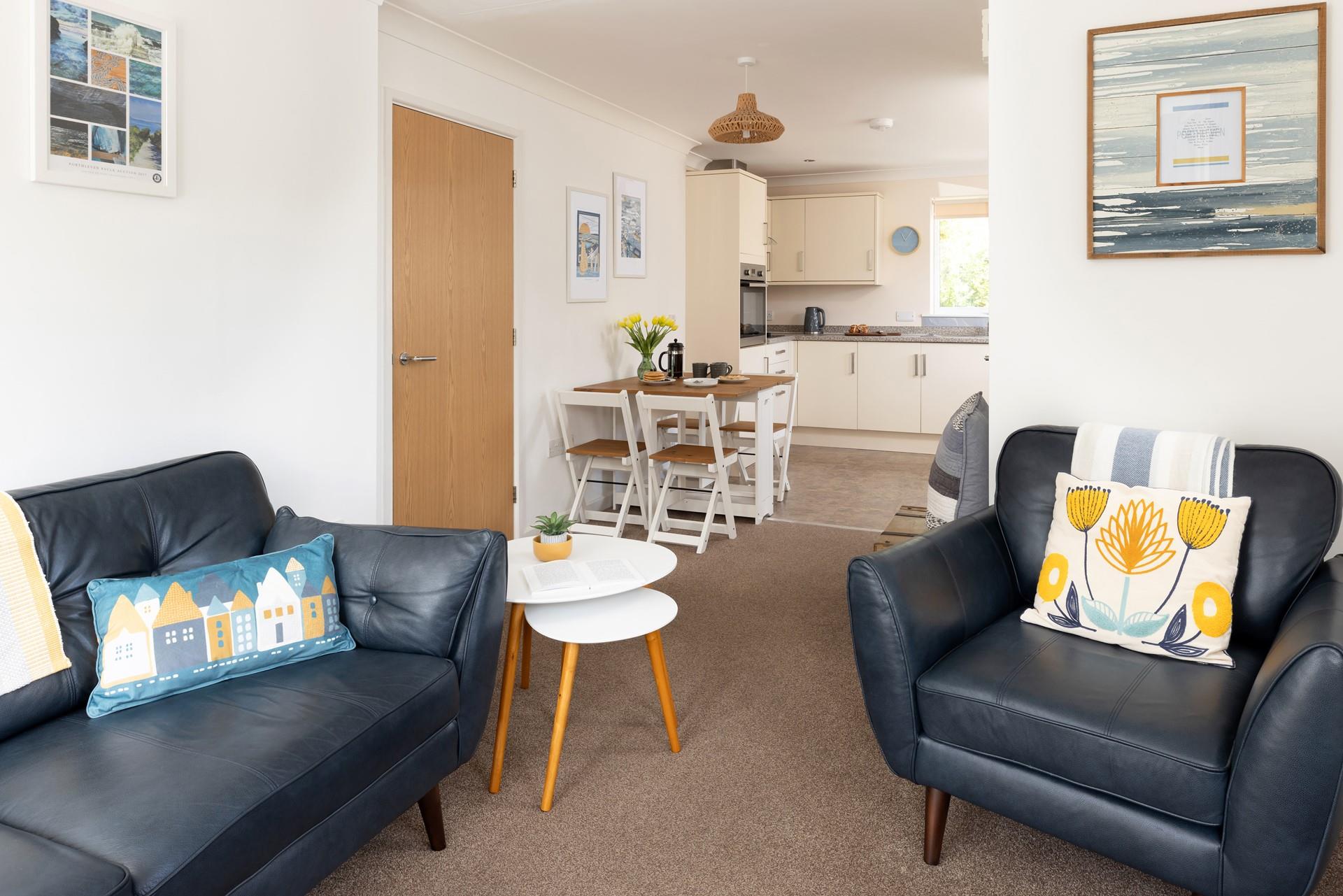 The open plan living and kitchen area creates a homely feel; perfect for relaxing together.